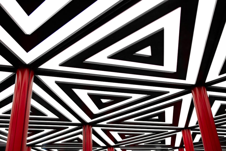 Striking abstract design featuring a geometric pattern of triangles with red columns.