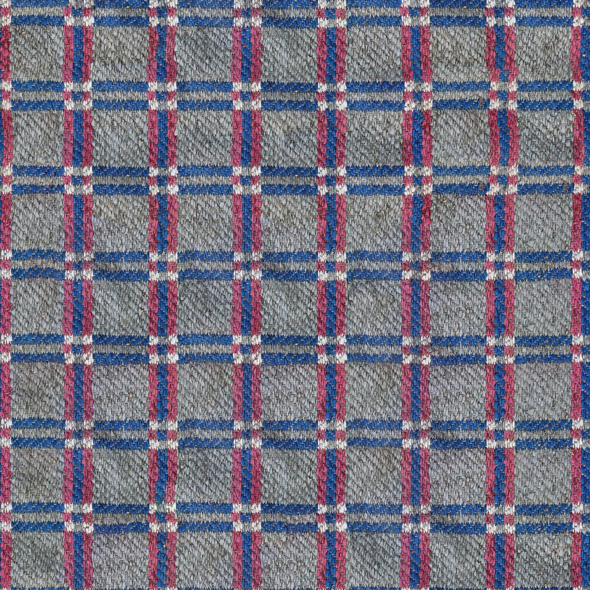 Gros plan sur la trame d'une toile textile colorée montrant la fibre teintée